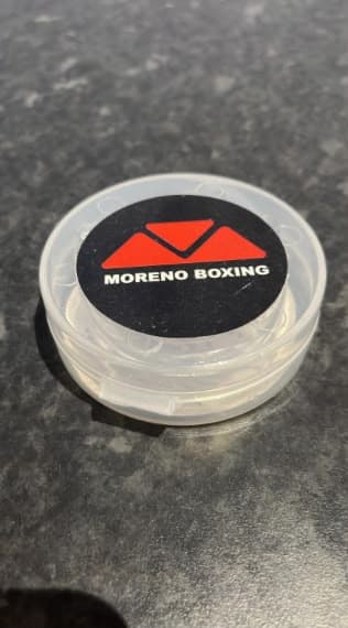 Moreno Boxing gum shield case on a dark surface